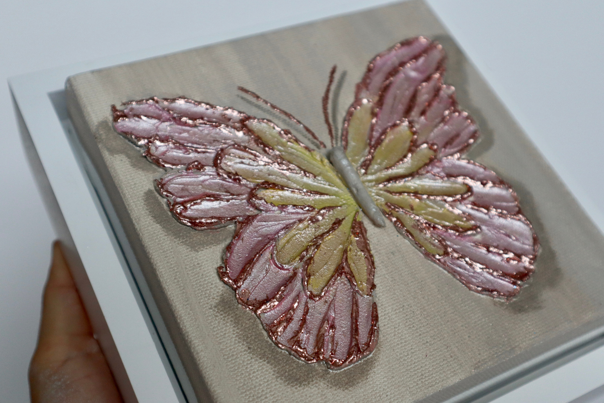 Rose Gold Open Wing Butterfly on Distressed Gray Canvas