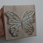 Seafoam Sparkle Open Wing Butterfly on Distressed Gray Canvas