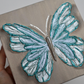 Sky Open Wing Butterfly on Distressed Gray Canvas