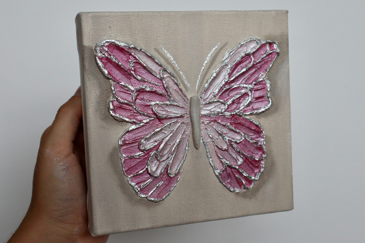 Taffy Pink Open Wing Butterfly on Distressed Gray Canvas