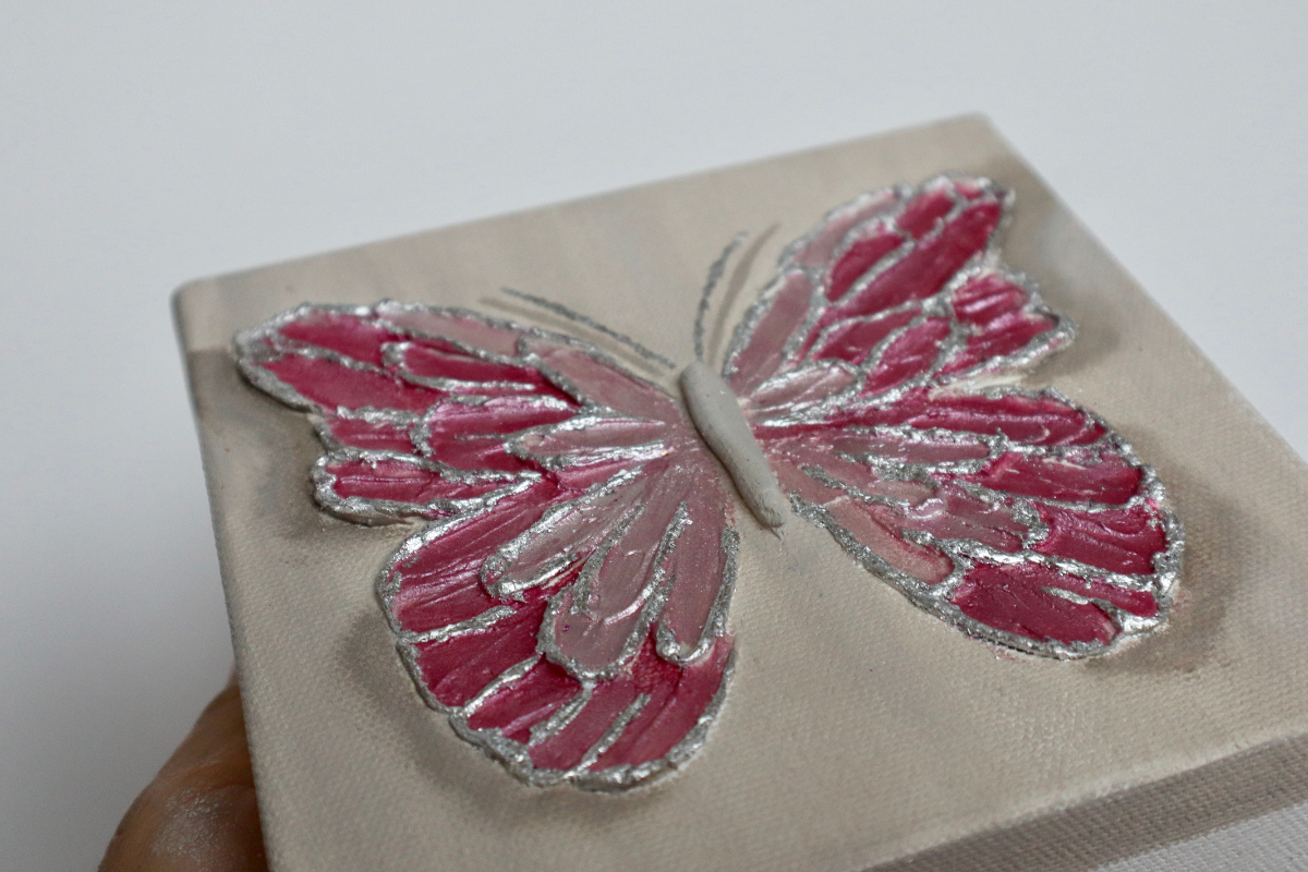 Taffy Pink Open Wing Butterfly on Distressed Gray Canvas